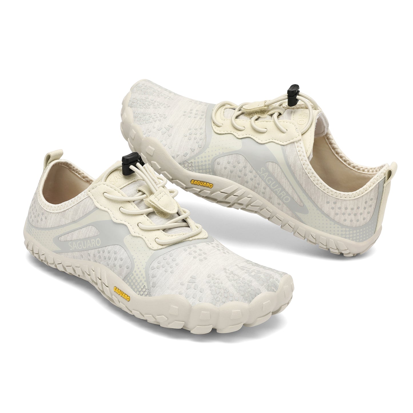 Pair of white athletic shoes with black accents on a white background