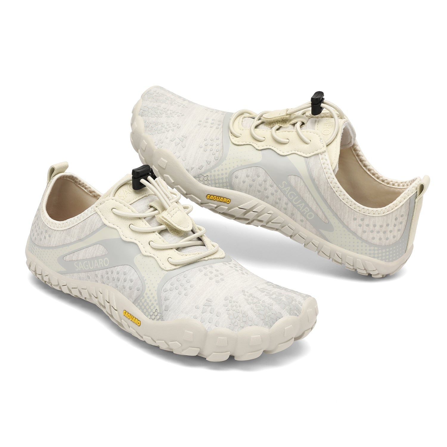 Pair of white athletic shoes with black accents on a white background